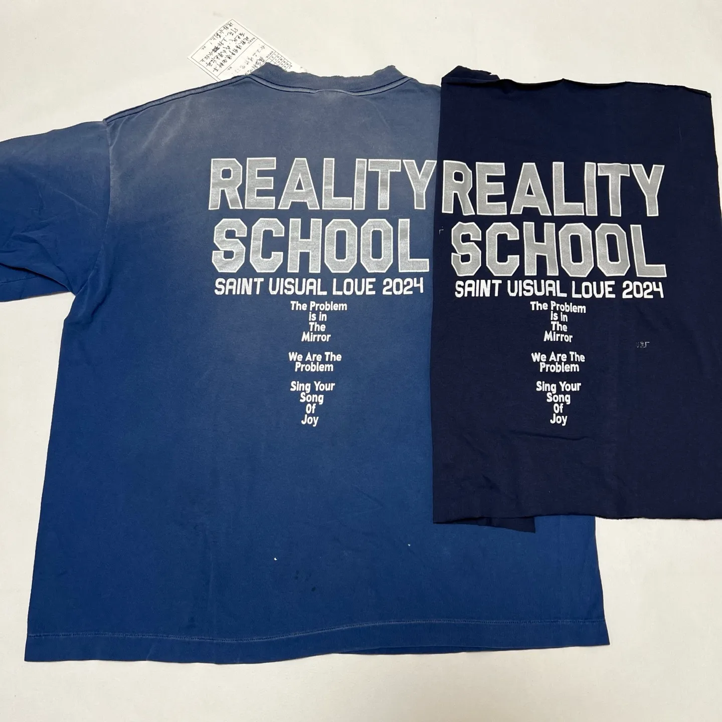 Printing proofing SAINT Mxxxxxx REALITY SCHOOL SS_TEE/NVY Slogan distressed short-sleeves Washed blue S-XL Garment dyeing Ma Liu fading Super complex shearing and destruction treatment Correct version Cylindrical fabric Customized original consistent main mark/wash mark Original consistent silver powder printing Distressed treatment